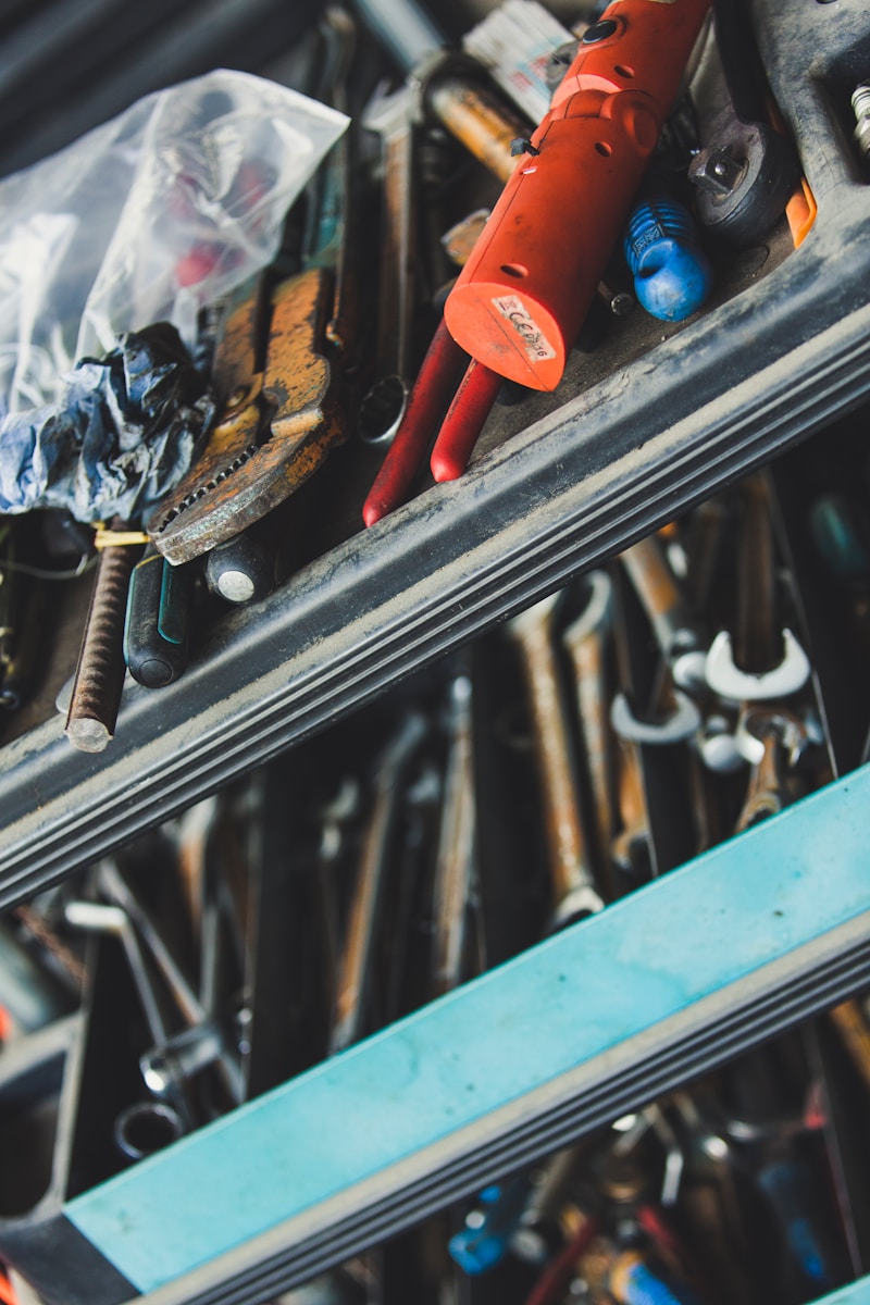 selective focus photography of tools in chest