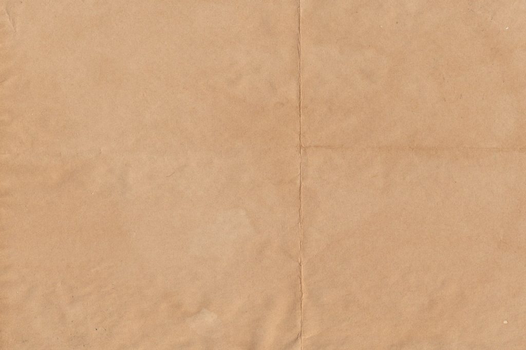 a piece of brown paper with a white background