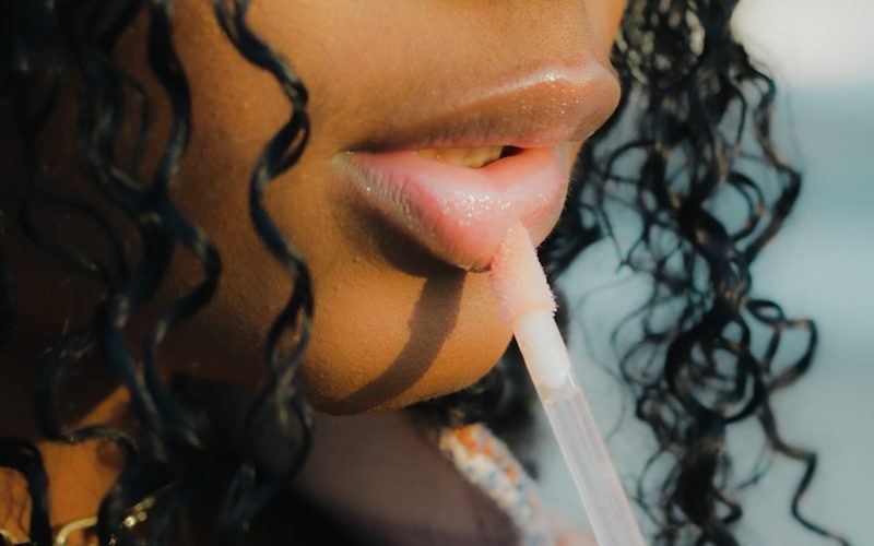 a close up of a person holding a toothbrush